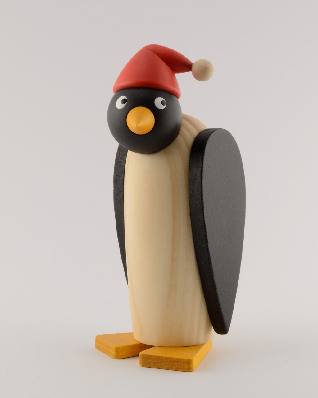 Pinguinfrau mit roter Zipfelmütze