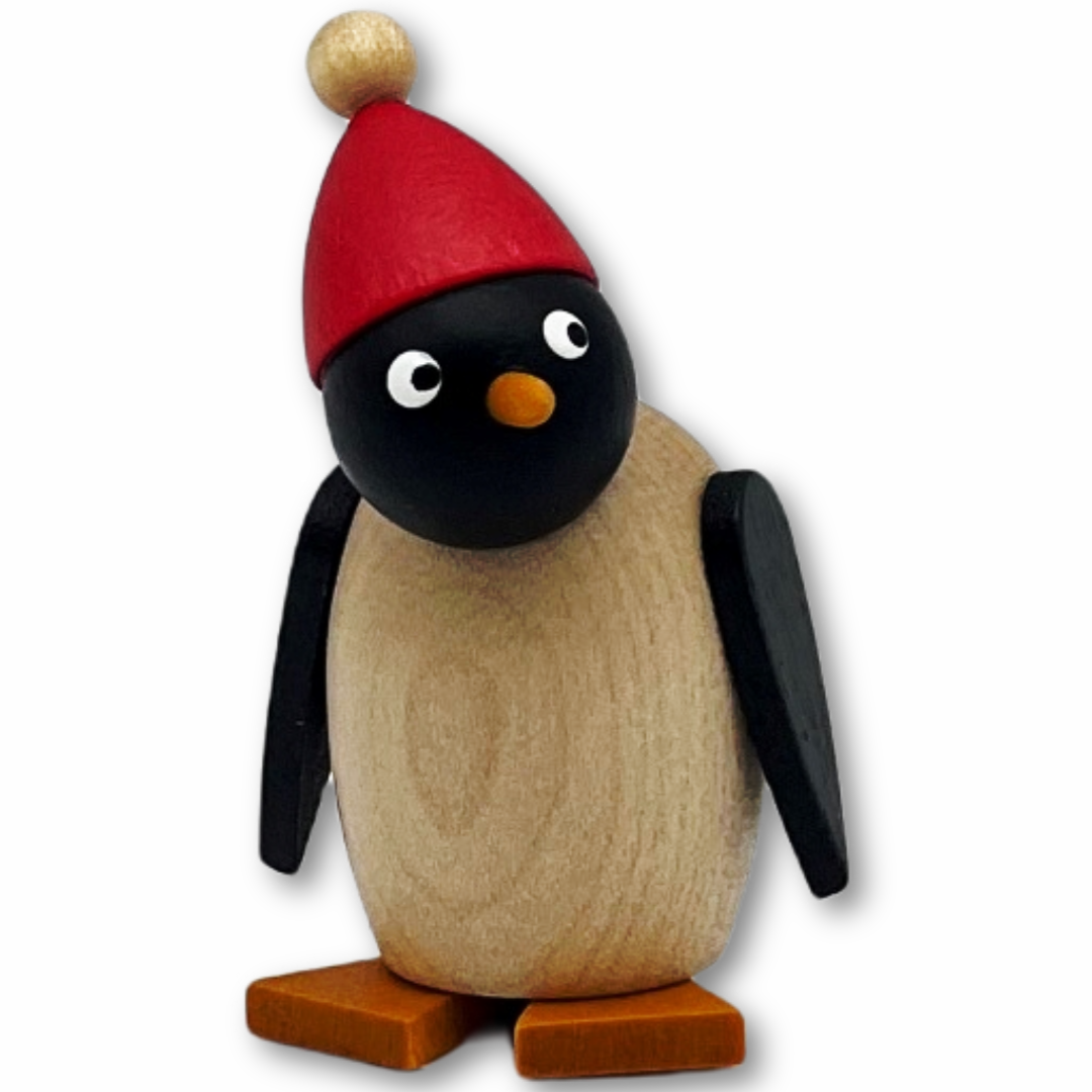 Pinguinbaby mit roter Mütze